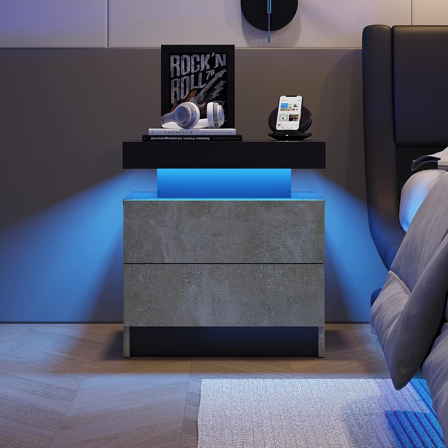 Nightstand with 2 drawers in gray concrete finish, blue LED underglow; headphones and smartphone on top (Doba)
