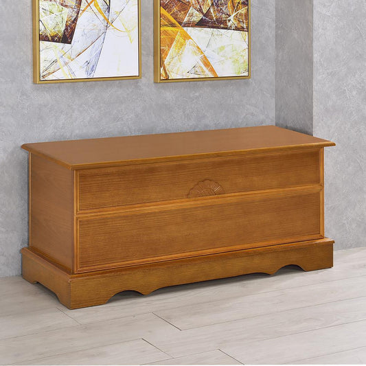 Honey Cedar Chest, honey-colored wood storage chest with a carved fan motif on the drawer front.