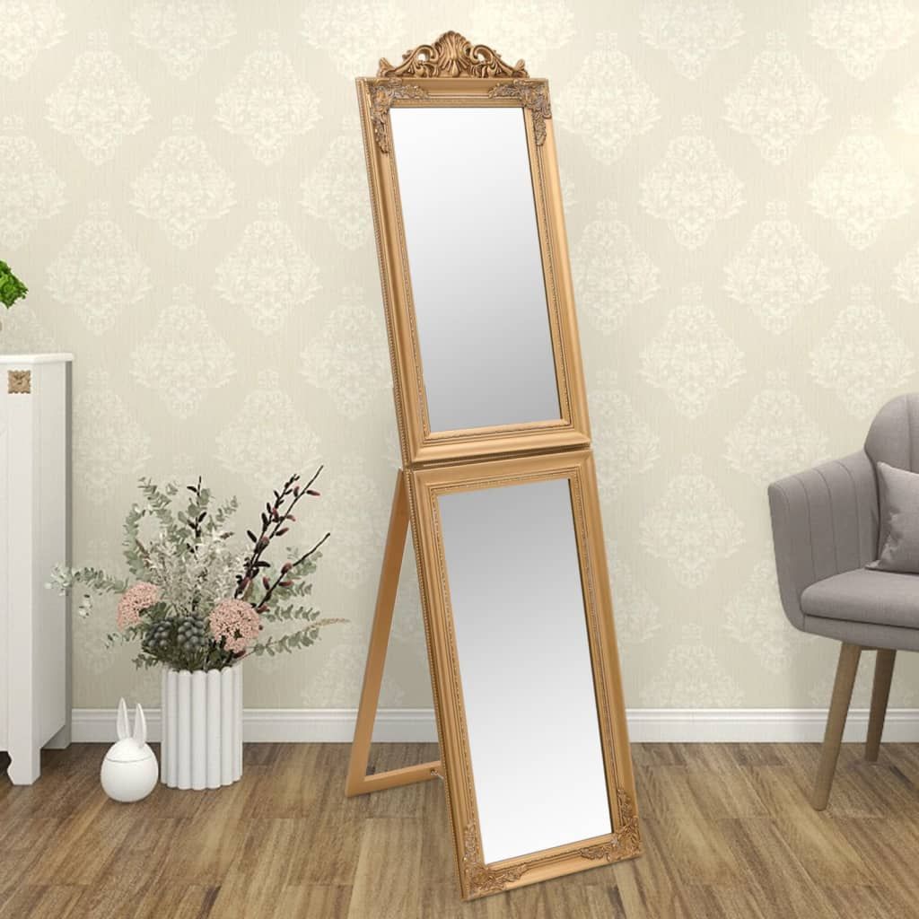 Free-standing gold-framed two-panel mirror on eucalyptus and engineered wood frame