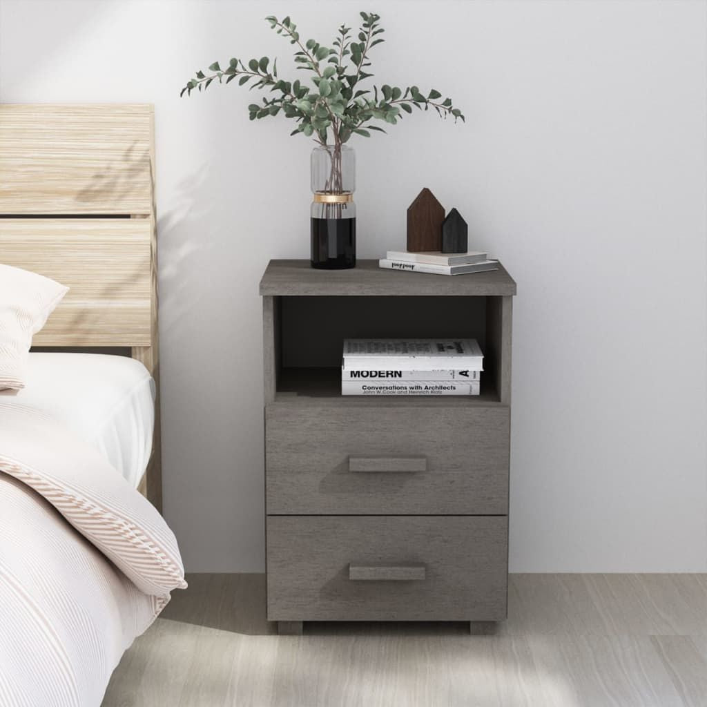 Bedside cabinet in light grey solid pinewood with open shelf and two drawers beside a bed.