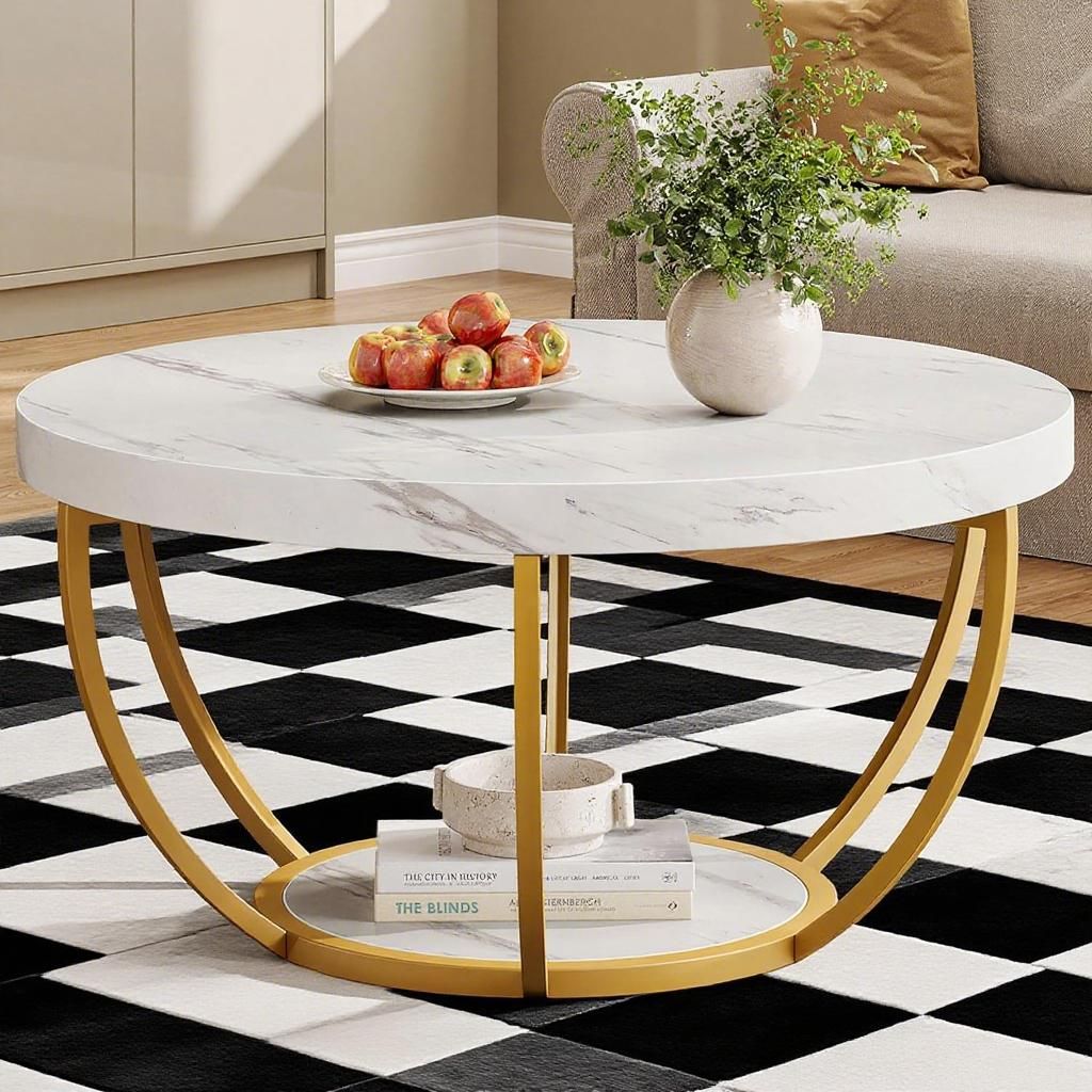 Coffee table with round white marble top and gold circular metal legs in a modern living room
